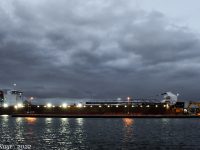 Lights shine bright as Mark W. Barker arrives the Soo's West Pier with sand for the wall restoration project. David Kaye image, October 17