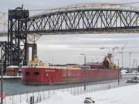 Dirk-S-VanEnkevortMichigan-Trader-upbound-at-the-West-Pier-of-the-Soo-Locks.-12-1-25-David-Kaye.png